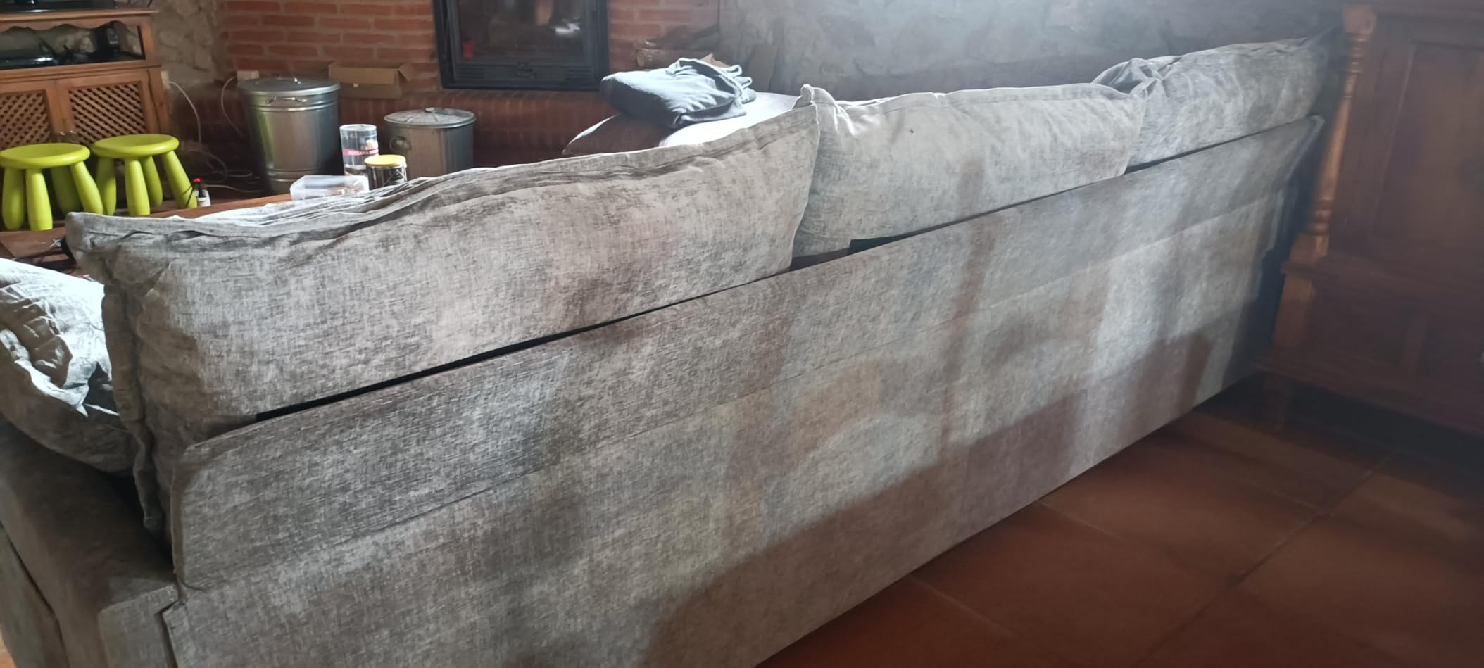 Customer photo of the sofa by a fireplace