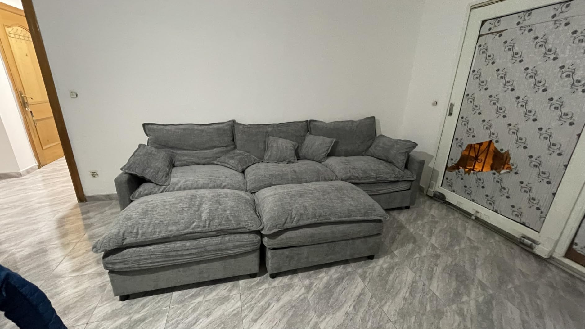 Customer photo of the sofa against a white wall